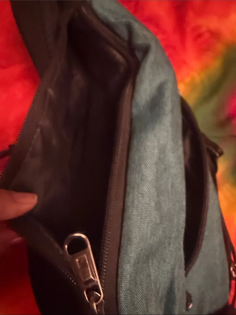 Teal Sling Backpack with Red Accent
